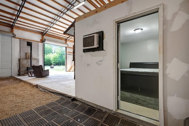 3155 Pigeon Spur Rd, Tracy City, TN 37387 - garage featuring a wood stove and an AC wall unit