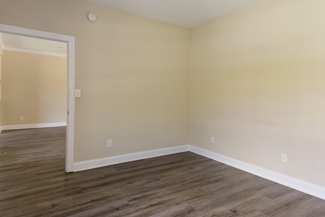 318 Tulip Tree Trl, Estill Springs, TN 37330 - spare room featuring dark wood-style flooring, crown molding, and a smoke detector