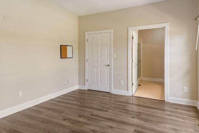 318 Tulip Tree Trl, Estill Springs, TN 37330 - unfurnished bedroom with wood finished floors and baseboards