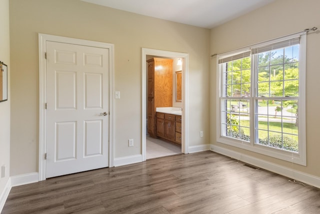 318 Tulip Tree Trl, Estill Springs, TN 37330 - unfurnished bedroom with wood finished floors and ensuite bathroom