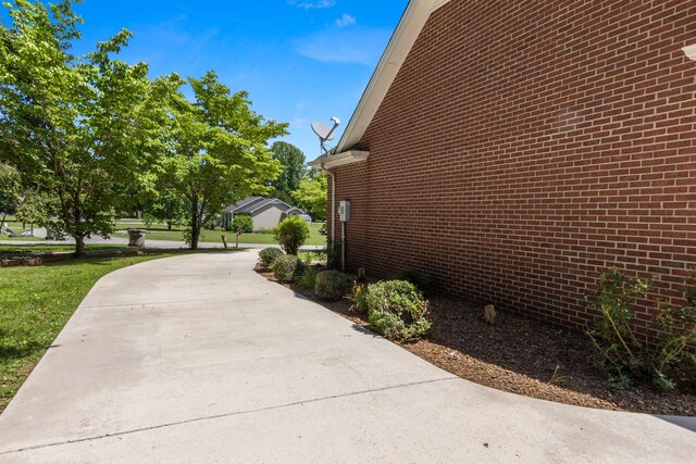 318 Tulip Tree Trl, Estill Springs, TN 37330 - view of side of home featuring brick siding