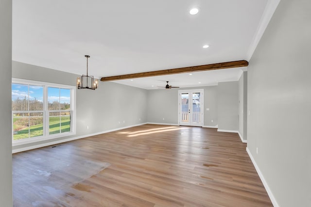 2600 Spring Arbor Ct, Cookeville, TN 38501 - unfurnished room with baseboards, plenty of natural light, beamed ceiling, light wood finished floors, and a chandelier