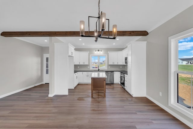 2600 Spring Arbor Ct, Cookeville, TN 38501 - kitchen featuring appliances with stainless steel finishes, a chandelier, beamed ceiling, baseboards, and recessed lighting