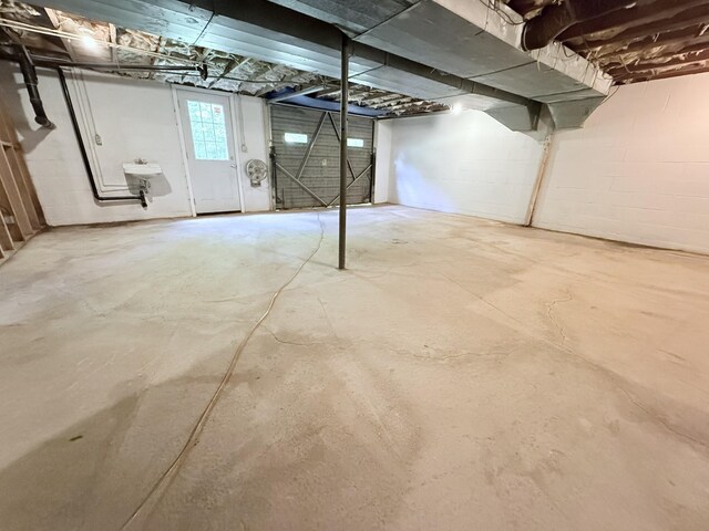 551 Maple Ter, Lafayette, TN 37083 - basement featuring a sink and concrete block wall