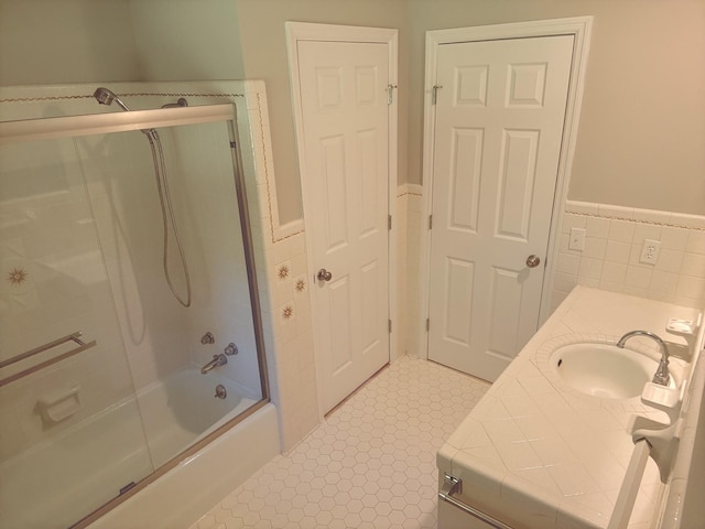 551 Maple Ter, Lafayette, TN 37083 - bathroom with tile walls, wainscoting, vanity, enclosed tub / shower combo, and tile patterned floors