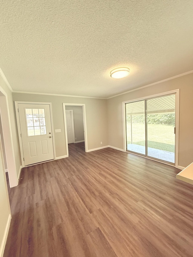 551 Maple Ter, Lafayette, TN 37083 - unfurnished living room with wood finished floors, crown molding, plenty of natural light, a textured ceiling, and baseboards