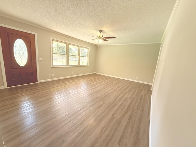 551 Maple Ter, Lafayette, TN 37083 - entryway with a textured ceiling, ceiling fan, ornamental molding, wood finished floors, and baseboards