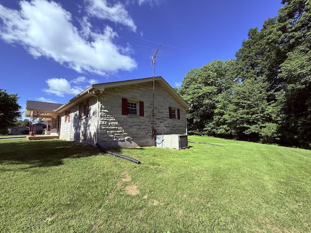 551 Maple Ter, Lafayette, TN 37083 - view of side of home featuring stone siding, a yard, and central air condition unit
