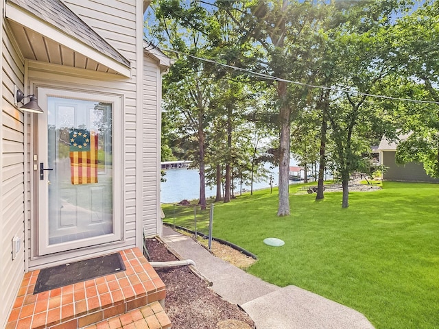 21 Heron Pt, Cadiz, KY 42211 - view of exterior entry with a lawn and a water view