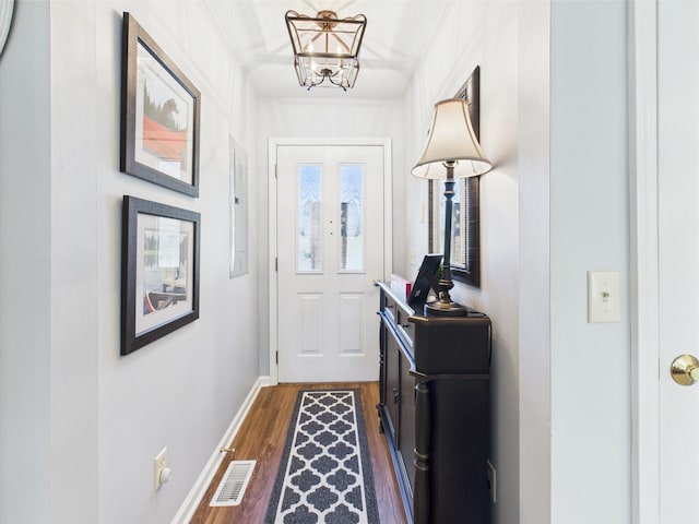 21 Heron Pt, Cadiz, KY 42211 - doorway with dark wood-style floors, a chandelier, and baseboards