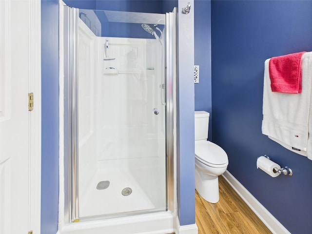 21 Heron Pt, Cadiz, KY 42211 - bathroom with a stall shower, wood finished floors, toilet, and baseboards
