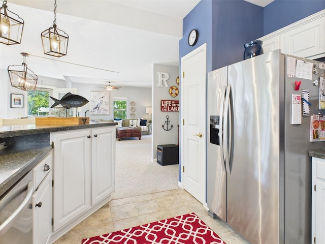 21 Heron Pt, Cadiz, KY 42211 - kitchen featuring stainless steel fridge with ice dispenser, dark countertops, white cabinetry, light carpet, and decorative light fixtures