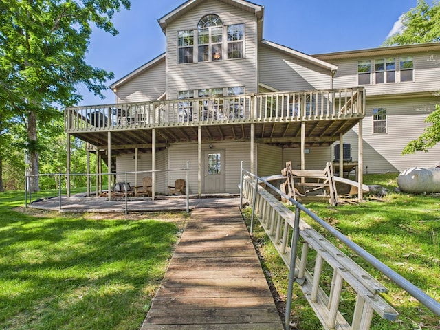 21 Heron Pt, Cadiz, KY 42211 - rear view of house featuring a deck, a yard, and a patio