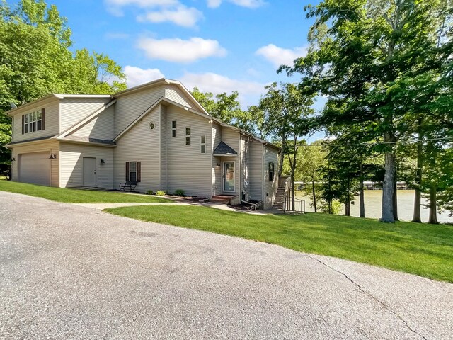 21 Heron Pt, Cadiz, KY 42211 - view of front of house featuring an attached garage, a front yard, and entry steps