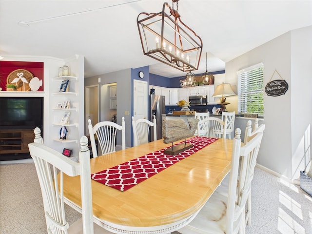 21 Heron Pt, Cadiz, KY 42211 - dining space featuring light carpet, a chandelier, and baseboards