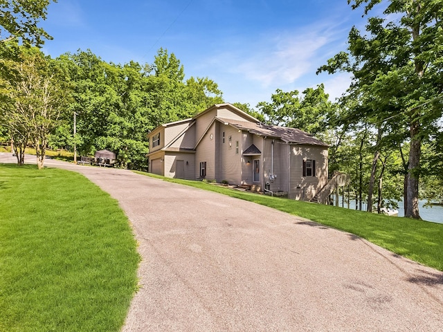 21 Heron Pt, Cadiz, KY 42211 - view of side of home with a yard, an attached garage, and driveway