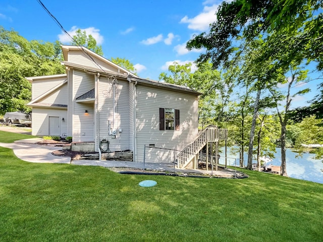 21 Heron Pt, Cadiz, KY 42211 - view of home's exterior featuring a lawn, a water view, and stairway