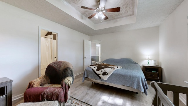 3507 Watts Ln, Murfreesboro, TN 37127 - bedroom featuring a tray ceiling, wood finished floors, baseboards, and crown molding