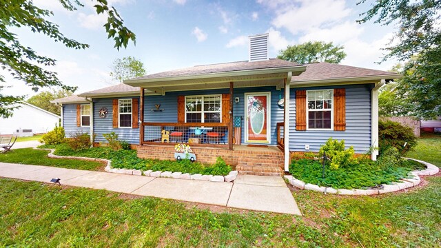 3507 Watts Ln, Murfreesboro, TN 37127 - view of front of house with a chimney, covered porch, and a front yard