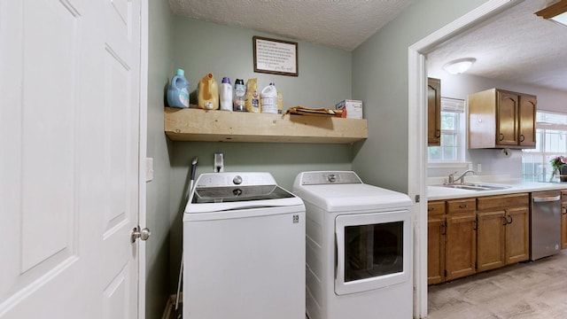 3507 Watts Ln, Murfreesboro, TN 37127 - laundry room featuring washer and dryer, light wood-style floors, and a textured ceiling