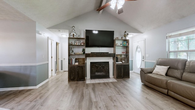 3507 Watts Ln, Murfreesboro, TN 37127 - living room with beamed ceiling, a fireplace with flush hearth, a ceiling fan, light wood-type flooring, and baseboards