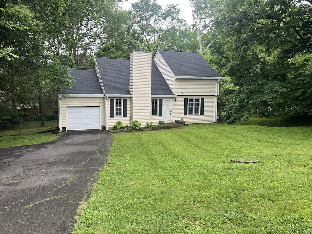 7214 Mark Dr, Nashville, TN 37221 - view of front of property with an attached garage, driveway, and a chimney