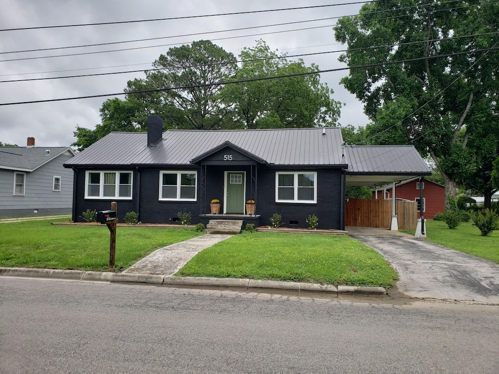 515 S Cedar Ln, Pulaski, TN 38478 - ranch-style house featuring metal roof, driveway, crawl space, and a carport