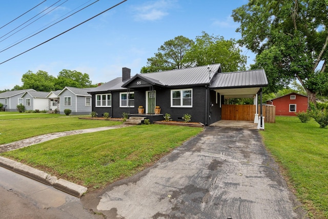 515 S Cedar Ln, Pulaski, TN 38478 - ranch-style home featuring asphalt driveway, a chimney, metal roof, and an attached carport