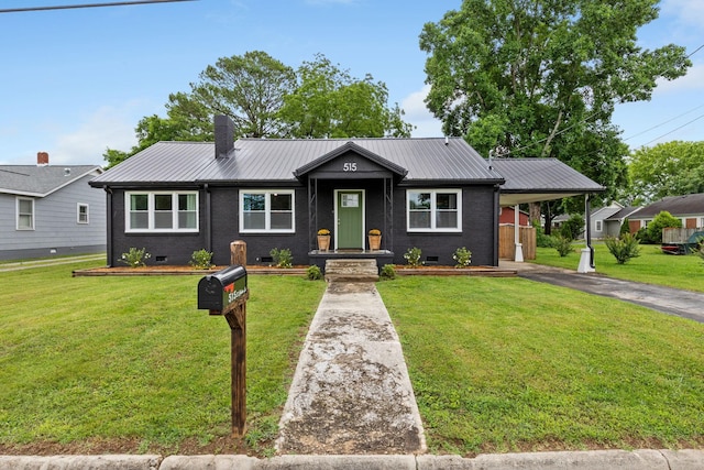 515 S Cedar Ln, Pulaski, TN 38478 - single story home with crawl space, metal roof, asphalt driveway, a carport, and brick siding