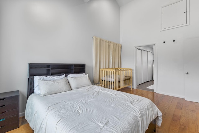 515 S Cedar Ln, Pulaski, TN 38478 - bedroom with a towering ceiling and wood finished floors