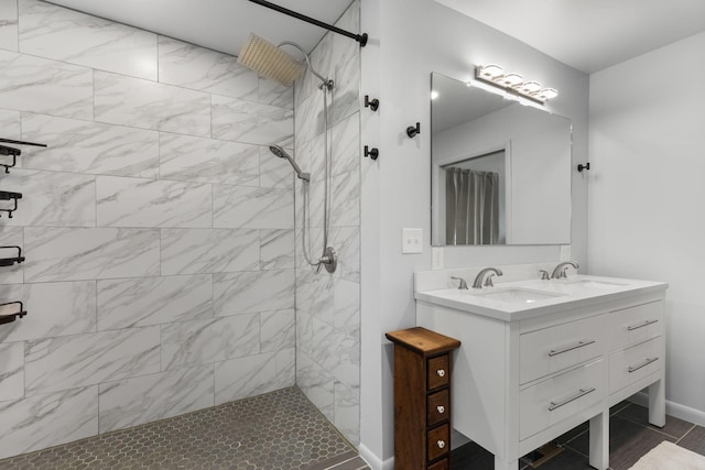 515 S Cedar Ln, Pulaski, TN 38478 - bathroom featuring a tile shower, double vanity, and baseboards