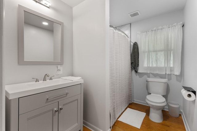 515 S Cedar Ln, Pulaski, TN 38478 - bathroom featuring wood finished floors, toilet, vanity, and baseboards