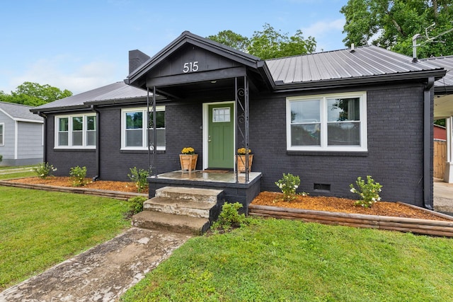 515 S Cedar Ln, Pulaski, TN 38478 - ranch-style home with a front lawn, metal roof, brick siding, and crawl space