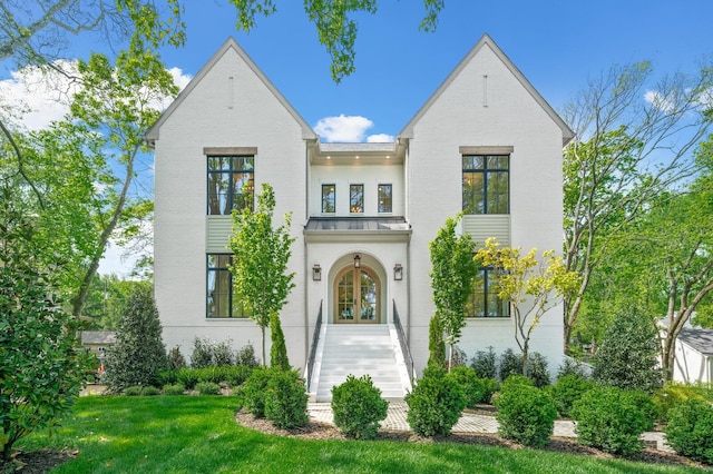 117 Alton Rd, Nashville, TN 37205 - view of front of home featuring french doors, a front yard, brick siding, a standing seam roof, and metal roof