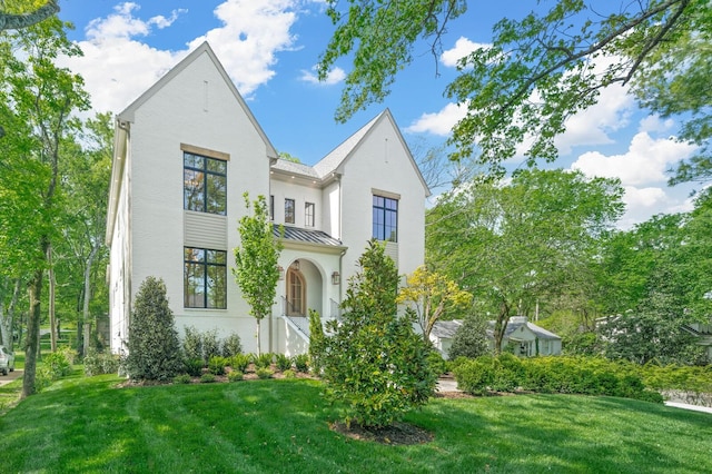 117 Alton Rd, Nashville, TN 37205 - view of front of property featuring a standing seam roof, a front yard, metal roof, and stucco siding