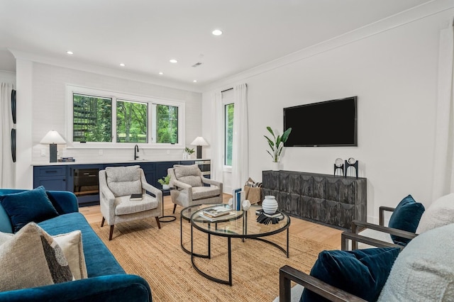 117 Alton Rd, Nashville, TN 37205 - living area featuring light wood-style flooring, ornamental molding, and recessed lighting