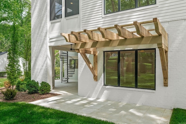 117 Alton Rd, Nashville, TN 37205 - doorway to property with brick siding, a pergola, and a patio