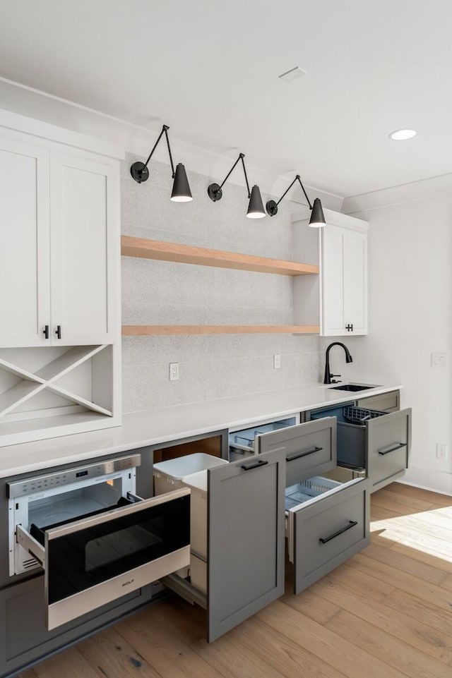 117 Alton Rd, Nashville, TN 37205 - kitchen with a sink, open shelves, white cabinets, light wood-style flooring, and recessed lighting