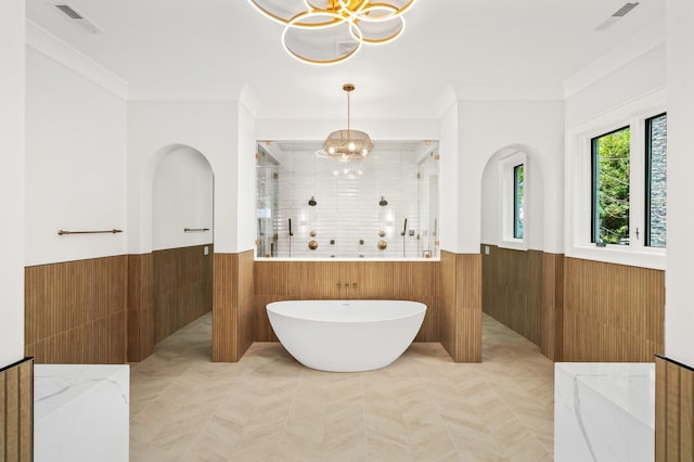 117 Alton Rd, Nashville, TN 37205 - full bathroom with wainscoting, a shower stall, a chandelier, a soaking tub, and ornamental molding