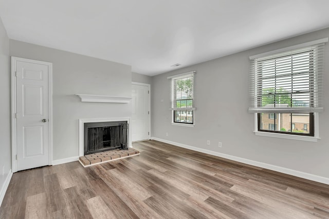 5839 Brentwood Trce, Brentwood, TN 37027 - unfurnished living room featuring wood finished floors, baseboards, and a fireplace with raised hearth