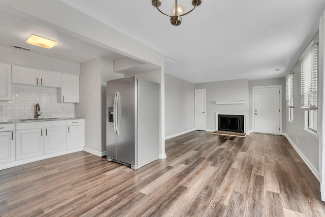 5839 Brentwood Trce, Brentwood, TN 37027 - kitchen with stainless steel fridge with ice dispenser, a sink, open floor plan, and light wood finished floors