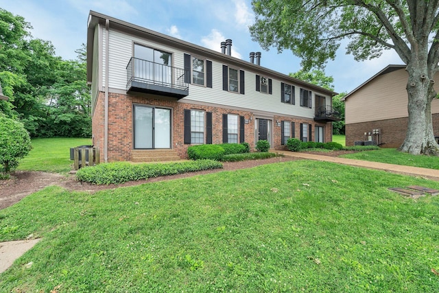 5839 Brentwood Trce, Brentwood, TN 37027 - view of property featuring a balcony, a front lawn, brick siding, and central AC unit