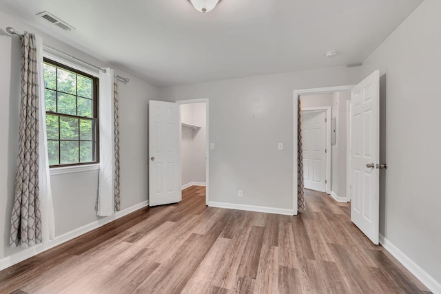 5839 Brentwood Trce, Brentwood, TN 37027 - unfurnished bedroom featuring wood finished floors, baseboards, and a spacious closet