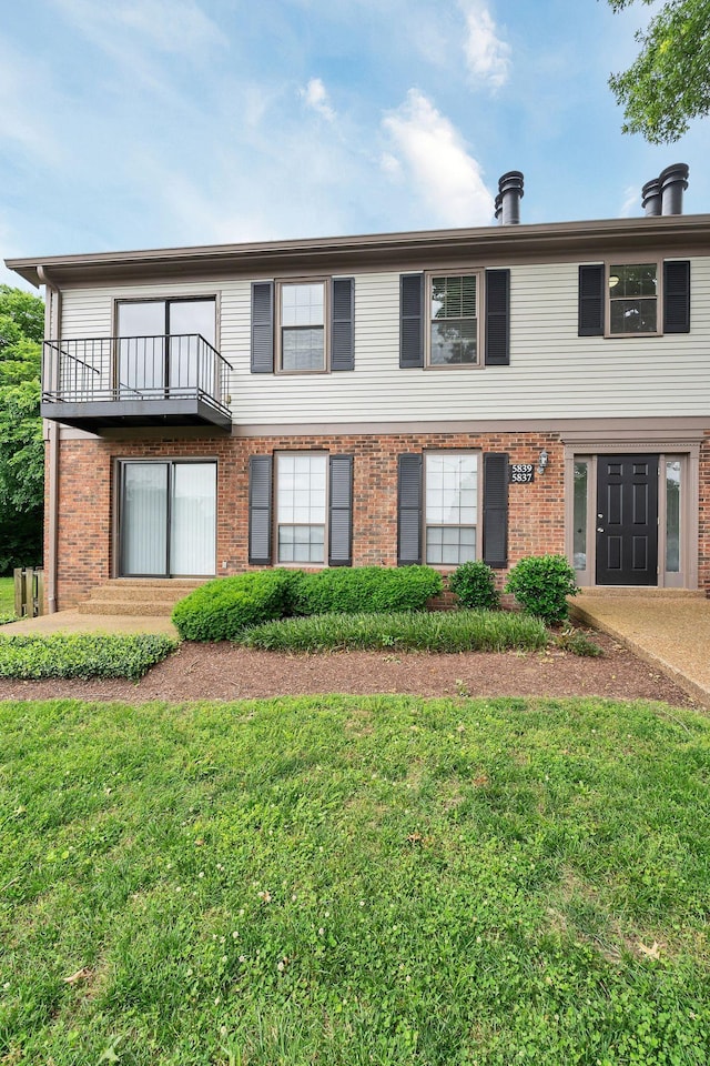 5839 Brentwood Trce, Brentwood, TN 37027 - multi unit property featuring a balcony, a front lawn, and brick siding