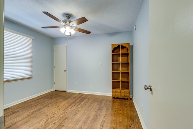 2023 Denise Dr, Columbia, TN 38401 - unfurnished room featuring wood finished floors, ceiling fan, baseboards, and a textured ceiling
