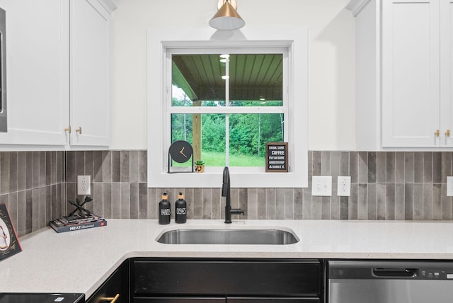 185 Dewberry Ct, Clarksville, TN 37042 - kitchen with dishwasher, a sink, white cabinets, and tasteful backsplash