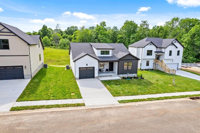 185 Dewberry Ct, Clarksville, TN 37042 - modern inspired farmhouse featuring a front lawn, driveway, and roof with shingles