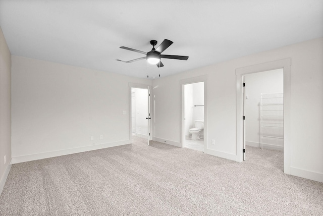 193 Dewberry Ct, Clarksville, TN 37042 - unfurnished bedroom with a walk in closet, carpet, baseboards, ensuite bath, and a closet