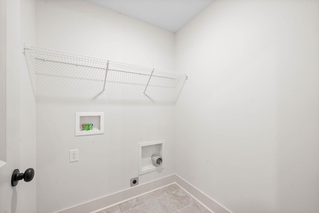 193 Dewberry Ct, Clarksville, TN 37042 - laundry area with baseboards, hookup for an electric dryer, washer hookup, and light tile patterned flooring