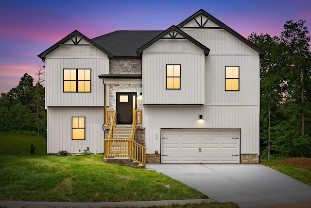 197 Dewberry Ct, Clarksville, TN 37042 - view of front of property featuring a garage, stone siding, a lawn, and driveway
